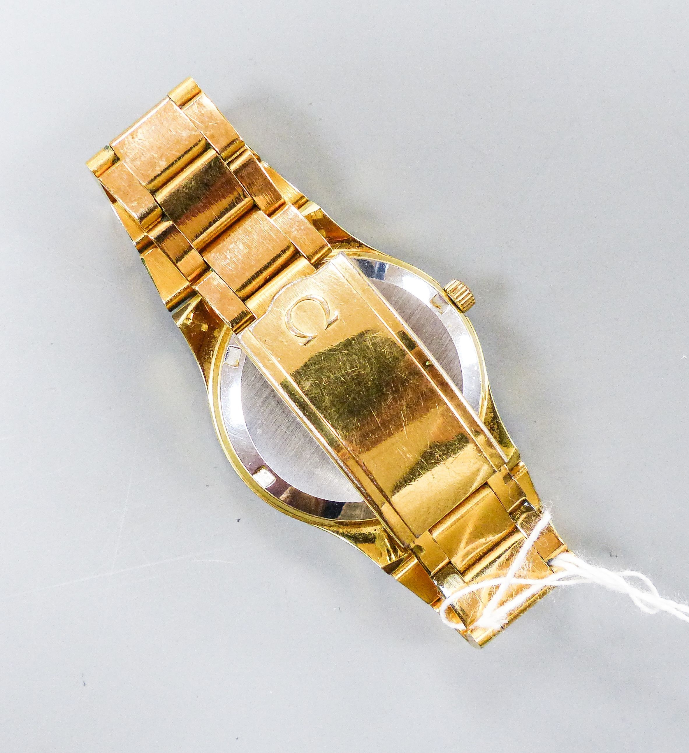 A gentleman's gold plated Omega automatic wristwatch, with date aperture, on a gold plated Omega bracelet, case diameter 37mm.